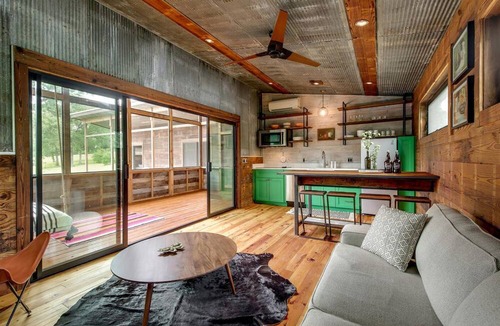 Elgin House | Artisan Cabin with Beautiful Decor and a Classic Fire Pit near Austin, Texas