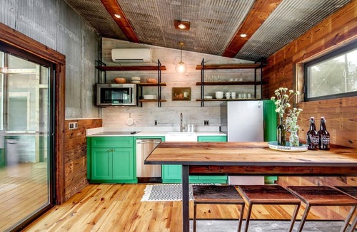 Elgin House | Artisan Cabin with Beautiful Decor and a Classic Fire Pit near Austin, Texas