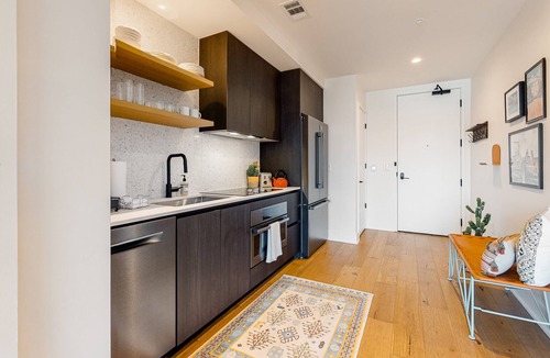Rainey Street Historic District Apartment | Austin studio condo with WiFi, balcony, W/D, full kitchen, rooftop pool, & gym
