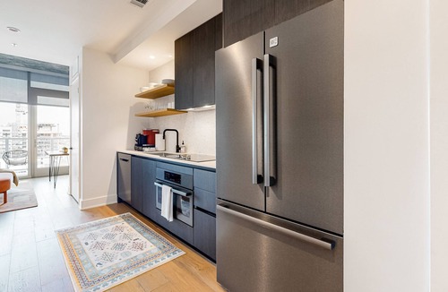 Rainey Street Historic District Apartment | Austin studio condo with WiFi, balcony, W/D, full kitchen, rooftop pool, & gym