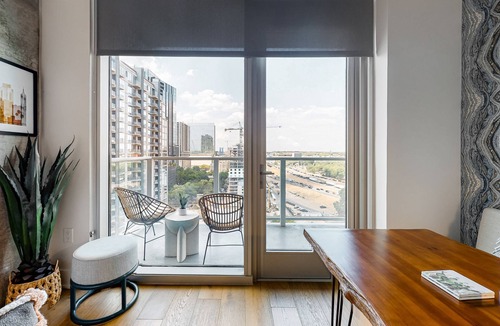 Rainey Street Historic District Apartment | Austin studio condo with WiFi, balcony, W/D, full kitchen, rooftop pool, & gym
