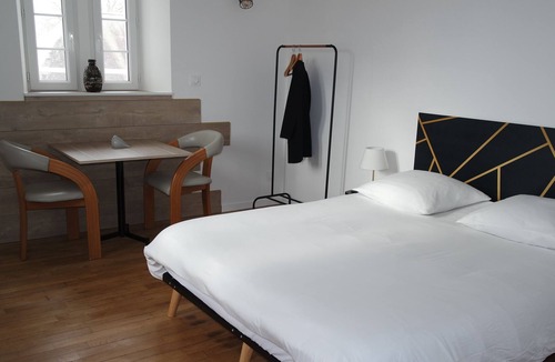 Aizenay Bed & Breakfast | Authentic room with neat decor