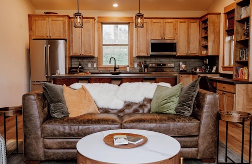 Emigrant House | Backroad Cabin cozy, private retreat, fireplace, backyard with fire pit and string lights.