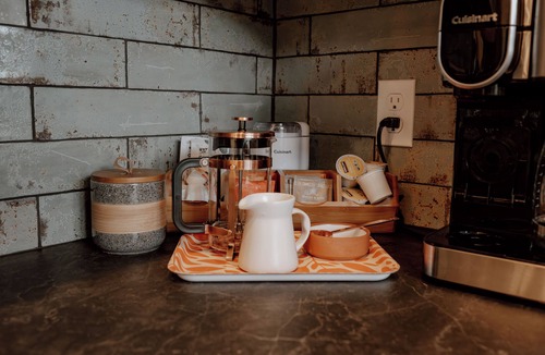Emigrant House | Backroad Cabin cozy, private retreat, fireplace, backyard with fire pit and string lights.