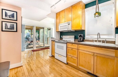 Three Oaks House | Backyard Oasis w Downtown Walkability, Fire Pit