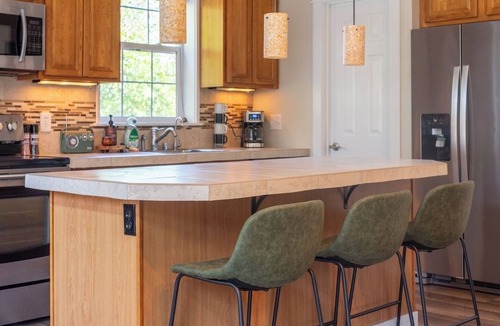 Mossyrock House | Backyard with hot tub and fire pit!