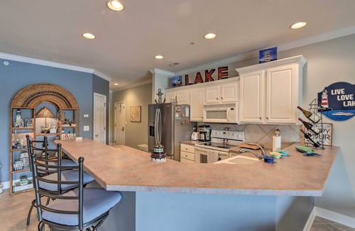 Camdenton Condo | Balcony & Seasonal Pool: Lakefront Ozark Condo