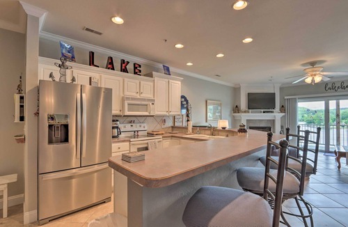 Camdenton Condo | Balcony & Seasonal Pool: Lakefront Ozark Condo