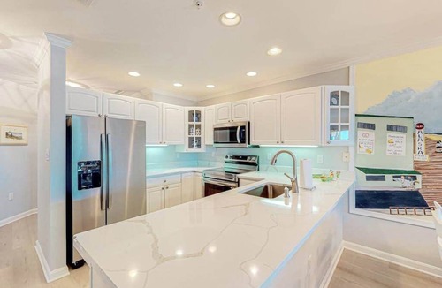Heron Harbour Isle Condo | Bayfront, 3rd-floor condo with great deck, sunset view, pool, piers & central AC