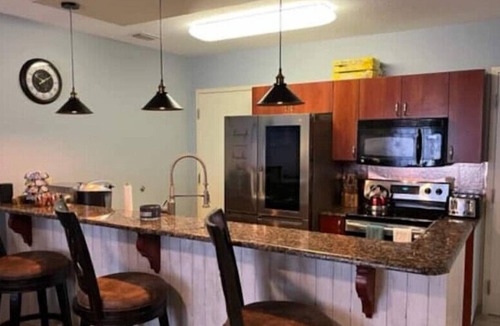 National Gardens Condo | Beach/Harley Davidson's King Bed & 75 inches