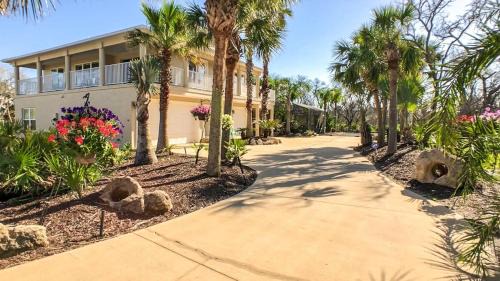 Marineland Acres House | Beach Home with Amazing Oasis Pool Spa Waterfall Fire Pit Bikes