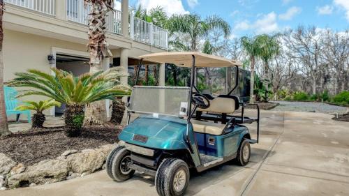 Marineland Acres House | Beach Home with Amazing Oasis Pool Spa Waterfall Fire Pit Bikes