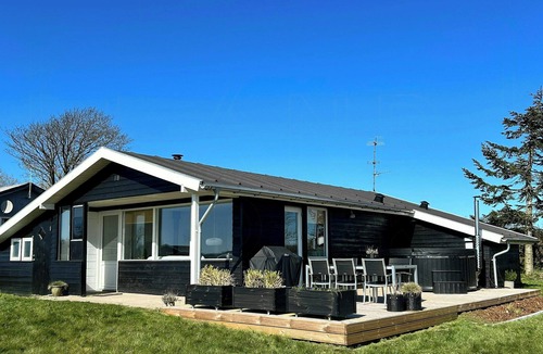 Skyum House | Beach hotel inspired holiday home by Limfjorden