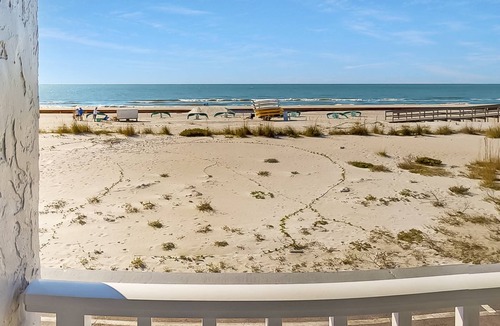 Treasure Island Condo | Beachfront Balcony ~ View of Treasure Island Beach ~ Heated Pool, Tiki Bar, BBQ Grills, Volleyball.
