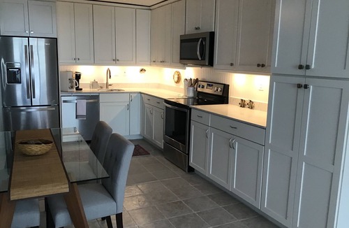 Galveston Condo | Beachfront condo on East Beach. Gulf, bay views. EV charger. Full kitchen, wifi.