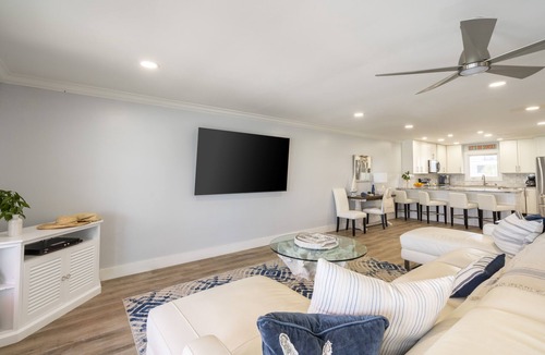 Frangista Beach House | Beachfront Hot Tub Covered Lounge | Backyard Beach by AvantStay