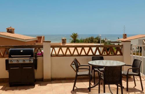 Urbanizacion Costabella House | Beachfront with Private Terrace, Garden, BBQ, and Garage in Marbella