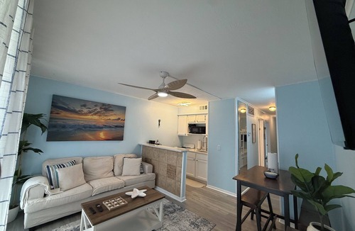 North Beach Condo | Beachside escape at Villa Del Sol—steps away to sand, pool, Aquarium & USS Lex.