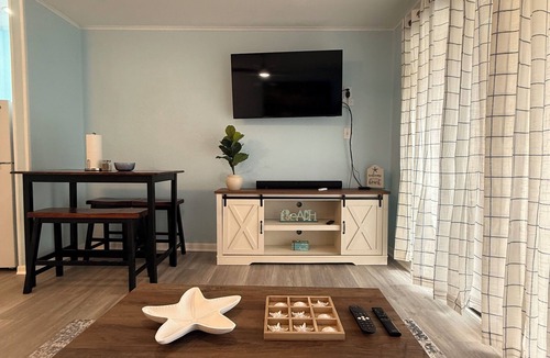 North Beach Condo | Beachside escape at Villa Del Sol—steps away to sand, pool, Aquarium & USS Lex.