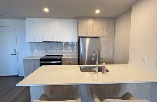 Laval Condo | Beautiful 3 1/2 apartment offering a bright open-concept living space.