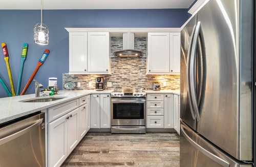 Heron Harbour Isle Condo | Beautiful, bay-view condo with pools, balcony, beach gear, AC, & fireplace