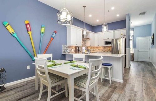 Heron Harbour Isle Condo | Beautiful, bay-view condo with pools, balcony, beach gear, AC, & fireplace