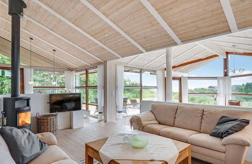 Handrup Strand House | Beautiful, bright cottage with large wooden terrace and sea view.