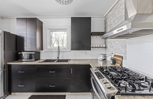 Laird Cottage | Beautiful cottage on the lake with brand new sauna, large yard and office space.