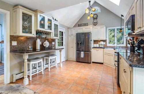 Eastham House | Beautiful Eastham home featuring lush gardens with heated in ground pool
