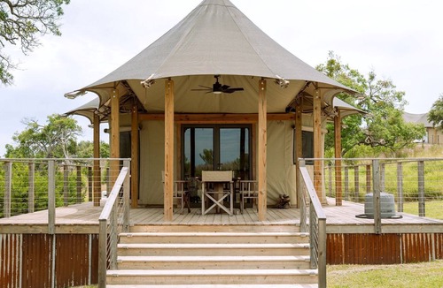 Fredericksburg House | Beautiful Glamping Lodge with Mini-Bar and Fire Pit for an Unforgettable Escape in Stonewall, Texas
