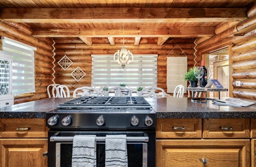 Ruthven House | Beautiful Log House with Fire Pit and Access to Private Trails