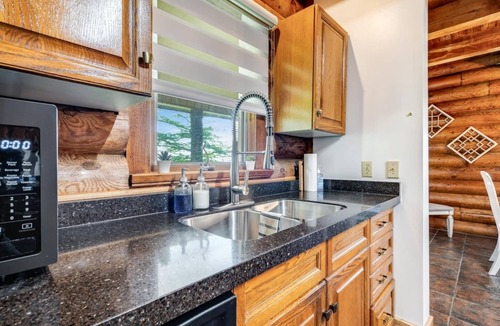 Ruthven House | Beautiful Log House with Fire Pit and Access to Private Trails