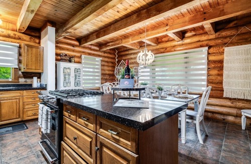Ruthven House | Beautiful Log House with Fire Pit and Access to Private Trails