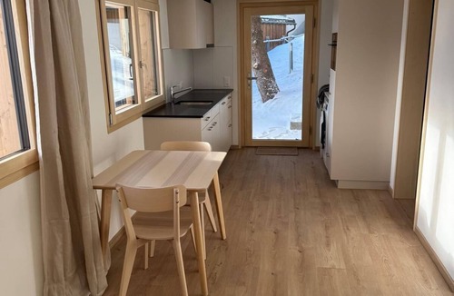 Andiast Apartment | Beautiful, modern studio with underfloor heating, kitchen, shower/WC and seating area.