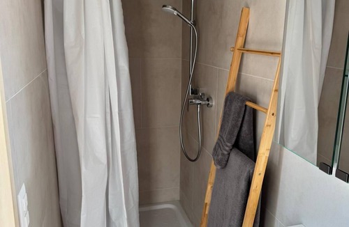 Andiast Apartment | Beautiful, modern studio with underfloor heating, kitchen, shower/WC and seating area.