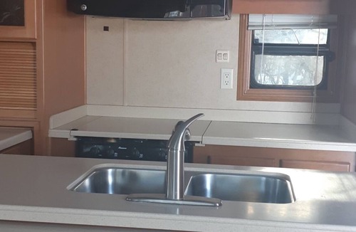 MacGregor RV Rental | Beautiful RV with a hot tub, at Ofty's Riverside Campground.