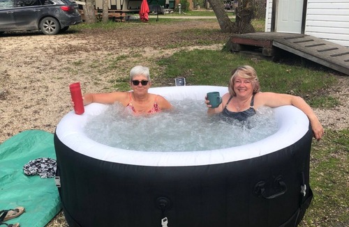 MacGregor RV Rental | Beautiful RV with a hot tub, at Ofty's Riverside Campground.