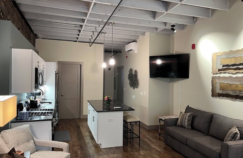 Downtown Syracuse Apartment | Beautiful Suite with Balcony overlooking Warren St in Syracuse
