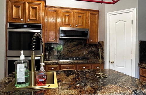 Alvin House | Beautiful Vacation Home ,Tropical Resort Pool with Waterfall and Heated Hot tub.