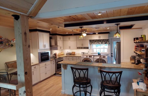Palm City House | Beautiful Waterfront Hideaway Gem on Bessy Creek w/Swim Spa, Tiki Bar Boat Lift