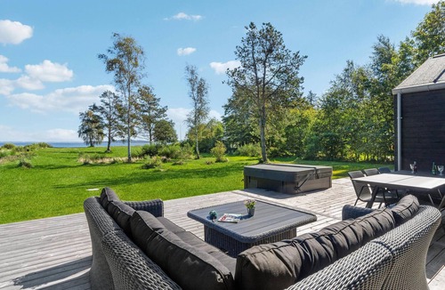 Hojslev House | Beautifully situated house on a natural plot with magnificent fjord views.