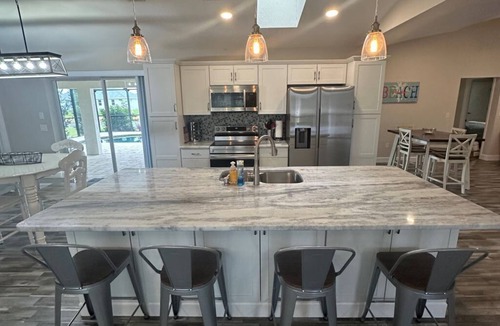 Pebble Beach House | Beautifully updated canal waterfront 3/2 house with heated pool in Rotonda West.