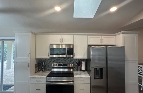 Pebble Beach House | Beautifully updated canal waterfront 3/2 house with heated pool in Rotonda West.