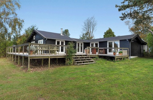 Faarevejle House | Black wooden house with panoramic views