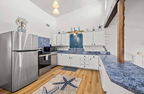 San Luis House | Blue Dolphin Retreat: Room to Roam, Steps to Shore