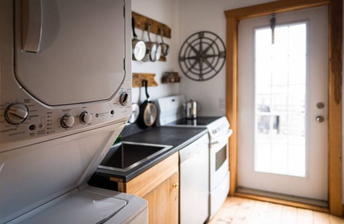Cheticamp Apartment | Boat house on the sea.