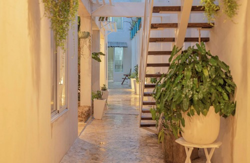 Zona Colonial Apartment | Bohechio studio with private balcony, pool views, ensuite bath, and kitchen.