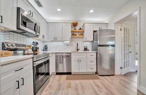 Sun Bay South House | Boho Oasis with Heated Pool, Billiards, Shuffleboard & More