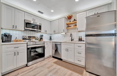 Sun Bay South House | Boho Oasis with Heated Pool, Billiards, Shuffleboard & More