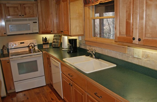Seven Devils Cabin | Book your Spring getaway now! Firepit. Pond view.